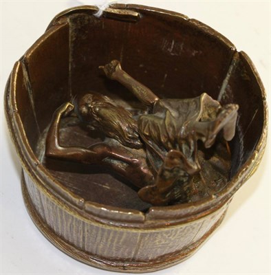 Lot 600 - A bronze Bergman figure in a barrel, 10cm diameter