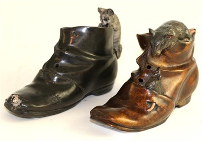 Lot 602 - Two bronze cast shoes, each stamped 'Geschutzt', 13cm diameter