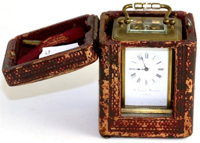 Lot 611 - A brass carriage timepiece, circa 1910, enamel dial inscribed 'A Bloch-Monney', 9cm high over...