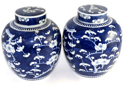 Lot 634 - A near pair of Chinese ginger jars and covers, 19th century, painted underglaze blue with the...