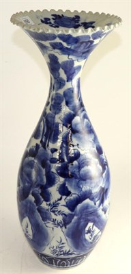 Lot 656 - An Arita porcelain baluster vase, Meiji period, painted on glazed blue landscape, 51cm high