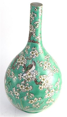 Lot 664 - A Chinese porcelain bottle vase, Kangxi reign mark but not of the period, painted in famille...