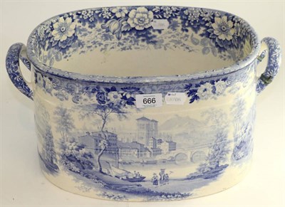 Lot 666 - # A Staffordshire pearlware foot bath, circa 1840, printed in underglaze blue with a...