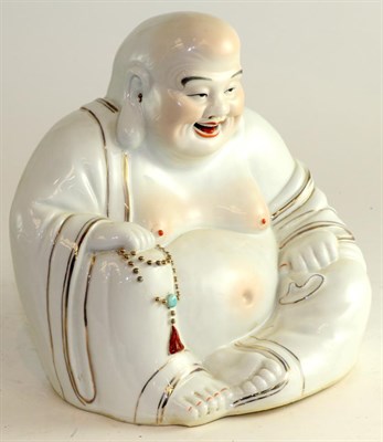 Lot 669 - A Chinese porcelain figure of Buddha sitting, painted in flesh tones and gilt, impressed seal mark