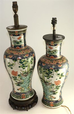 Lot 672 - A pair of Chinese porcelain baluster vases, 19th century, painted in famille verte enamels with...