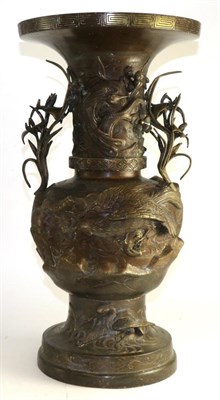 Lot 673 - A Japanese bronze vase, Meiji period, of baluster form cast with birds amongst leafy branches, 56cm