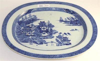 Lot 680 - A Chinese porcelain oval meat platter, Qianglong, painted undeglaze blue with a landscape, 46cm...