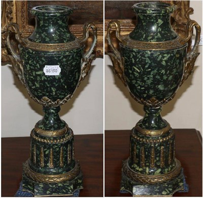 Lot 687 - A pair of French gilt bronze mounted green marble urns, 19th century, with leaves scroll and...