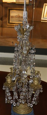 Lot 691 - A pair of cut glass and gilt metal table lustres, 19th century, with spire finials on baluster...