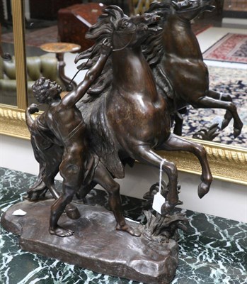 Lot 693 - After Coustou, a bronze figure of a Marly horse with attendant, signed COUSTOU, 47cm high