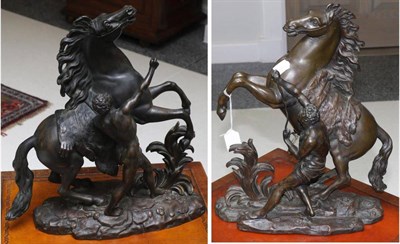 Lot 694 - A pair of bronze Marley horses (one a.f.), 40cm high