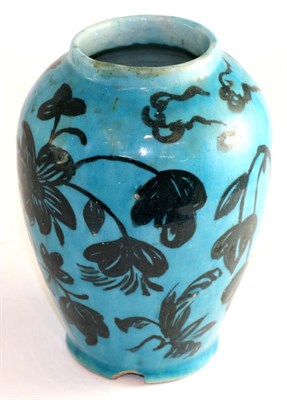 Lot 706 - ^ A Persian turquoise glazed baluster vase, 19th century, painted in underglaze black with...