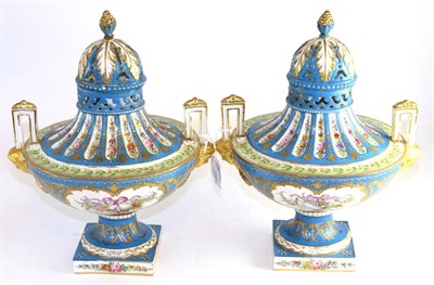 Lot 719 - A pair of Sèvres style porcelain twin-handled urn shaped vases and covers, late 19th century,...