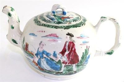 Lot 723 - A Staffordshire white salt glazed stoneware teapot and cover, circa 1750, painted with a...