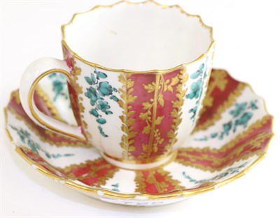 Lot 725 - A Derby red and gilt ground cup and saucer, 7cm high