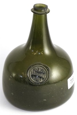 Lot 739 - A green glass mallet shaped bottle, E Herbert dated 1721, 19cm high