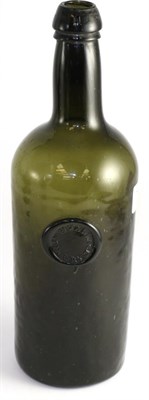 Lot 740 - An 18th century green glass bottle labelled, Wallis ?, 29cm high