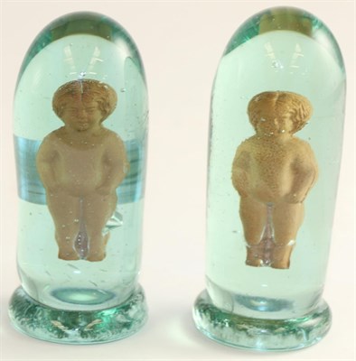 Lot 742 - A pair of Victorian glass dumps the interior with terracotta figures, 11cm high