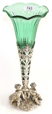 Lot 743 - A green glass and silver plated centrepiece, the base surmounted by cherubs, 35cm high