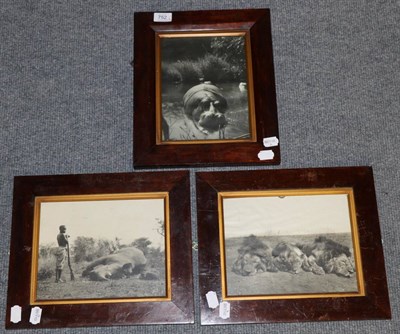 Lot 752 - Three black and white photographs of game including a rhino, three lions and a hippo, mounted...