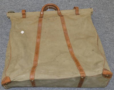 Lot 778 - A WWII canvas and leather travel bag with folding frame and blue fabric lined interior