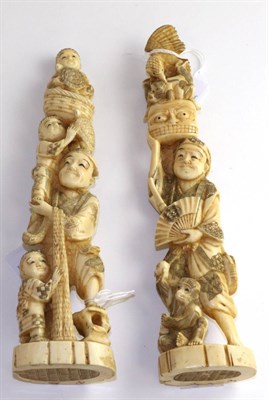 Lot 795 - A Japanese ivory okimono, Meiji period, as a fisherman with boys and turtles, 22cm high and another