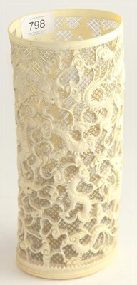 Lot 798 - A Chinese ivory tusk vase, late 19th century carved and pierced with dragons amongst scrolls on...