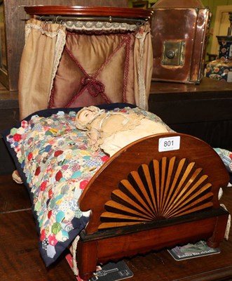 Lot 801 - A Victorian mahogany dolls half tester bed with drapery, 42cm high with a patchwork quilt and a...