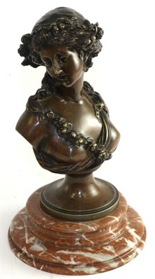 Lot 811 - A bronze bust of a classical maiden on a marble plinth, 28cm high