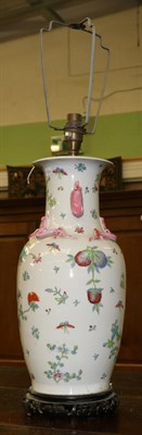 Lot 814 - A Chinese famille rose vase in the form of a table lamp decorated with flowers, insects and...