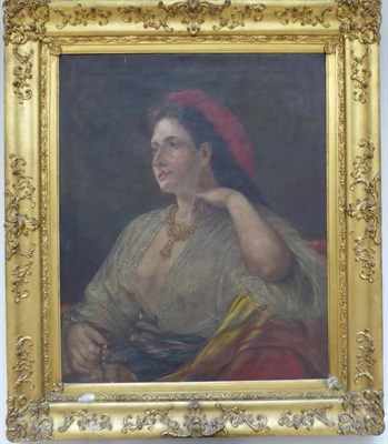 Lot 1016 - Circle of William Clarke Wontner (1857-1930) Portrait of a lady, half-length, seated wearing a...