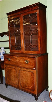 Lot 1232 - A Regency mahogany secretaire bookcase of large proportions, the moulded cornice above astragal...