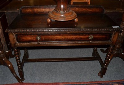 Lot 1253 - A 1920's oak bobbin turned hall table, 108cm wide