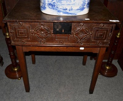 Lot 1263 - # A late 17th century bible box with hinged lid above a geometric carved panel, raised on a...