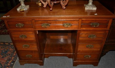 Lot 1272 - A late Victorian walnut desk, stamped James Shoolbred & Co, 123cm wide