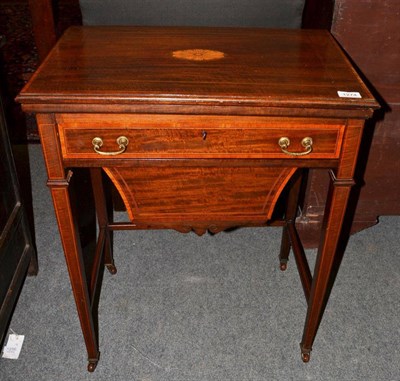 Lot 1274 - # An Edwardian mahogany and satinwood banded worktable, hinged leaf enclosing a gaming board,...