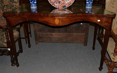 Lot 1280 - A George III mahogany serpentine serving table, inlaid shell detail, square tapered legs to...