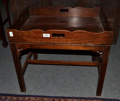 Lot 1281 - A George III mahogany tray top table with four carrying handles, raised on a later chamfered...