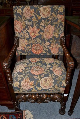 Lot 1282 - A walnut Jacobean style armchair later re-covered in floral fabric, 59cm wide