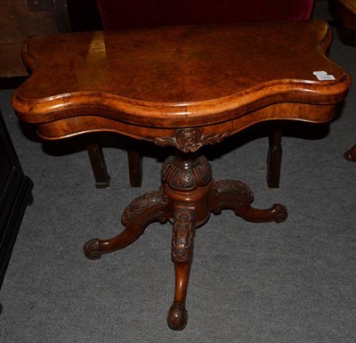 Lot 1286 - A Victorian walnut foldover card table, 89cm wide