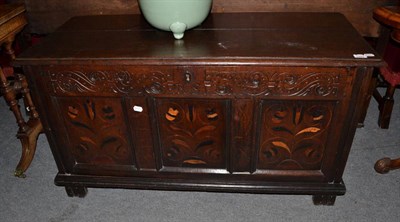 Lot 1287 - {} An 18th century carved oak chest with hinged lid, the frieze carved ARS above three...