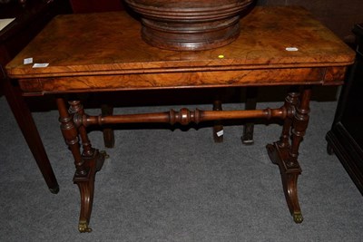 Lot 1288 - A Victorian figured walnut fold over card table, mid-19th century, quarter veneered top...