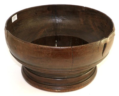 Lot 1291 - An English treen wassil bowl in walnut, 17th century, 39cm diameter