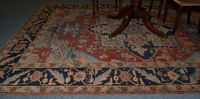 Lot 1310 - Heriz carpet, Iranian Azerbaijan, the brick red field centred by a cruciform medallion framed...