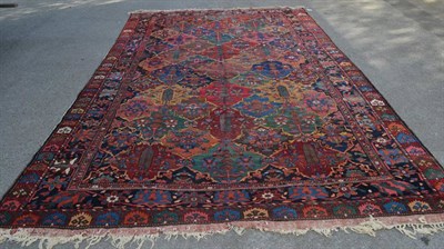 Lot 1311 - Bakhtiari carpet, West Iran, the polychrome diamond lattice field of stylised plants enclosed...