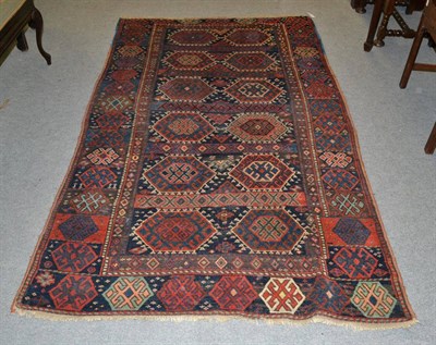 Lot 1315 - Rare Jaff Kurd Sanjabi rug, Iranian/Iraqi Border, the deep indigo compartmentalised field of...