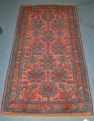 Lot 1316 - Good Hamadan rug, Iranian Kurdistan, the coral pink field of stylised flowerheads enclosed by...