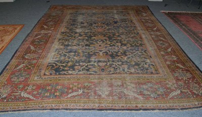 Lot 1320 - Sultanabad carpet, West Iran, the indigo field with an allover design of angular vines enclosed...