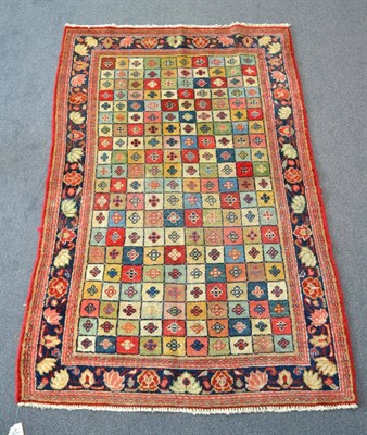 Lot 1328 - A Mahal rug, West Iran, the polychrome compartmentalised field enclosed by narrow borders, 152cm by