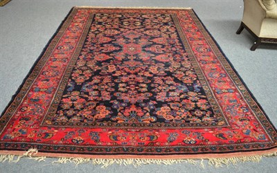 Lot 1344 - Hamadan carpet, Iranian Kurdistan, the indigo field with columns of flowers around an anchor...